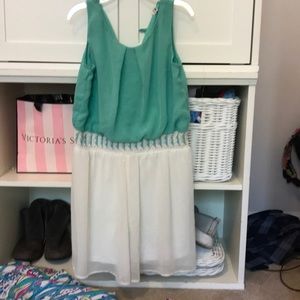 Teal and white romper with patterned waist band